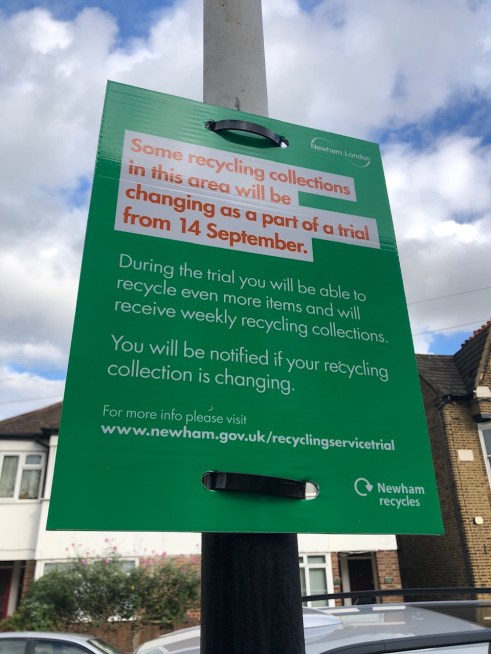 Sign on street informing residents about the recycling trial