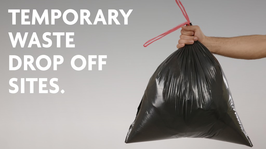 Temporary waste drop off sites.
Image of a hand holding a full black bin bag.